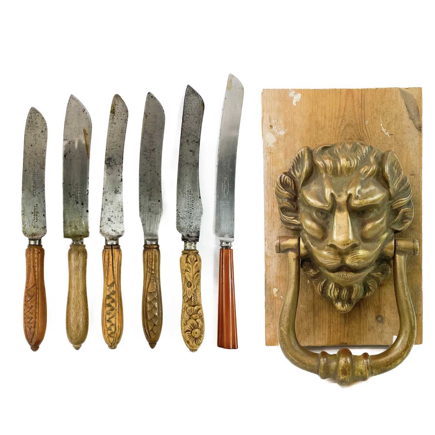 Lot 161 - A brass lion's mask door knocker.