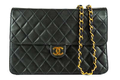 Lot 360 - A Chanel black quilted lambskin single flap wallet shoulder bag.