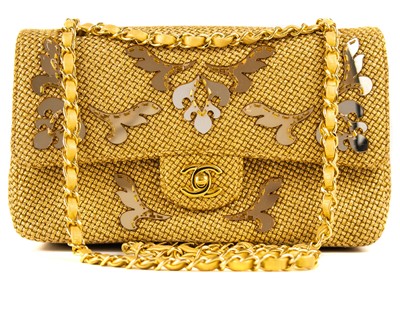 Lot 327 - A Chanel gold woven raffia 'Cruise Collection' medium classic double flap bag.