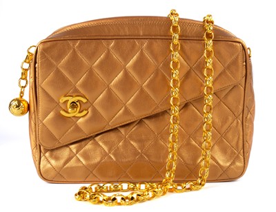 Lot 331 - A Chanel gold quilted leather turn lock camera bag.