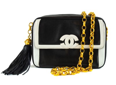 Lot 397 - A Chanel black and white lambskin leather camera bag.