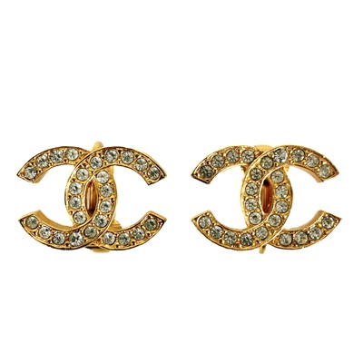 Lot 376 - A pair of Chanel CC gold plated crystal set clip earrings.