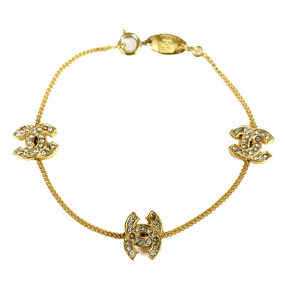 Lot 400 - A Chanel CC design gold plated and crystal set bracelet.