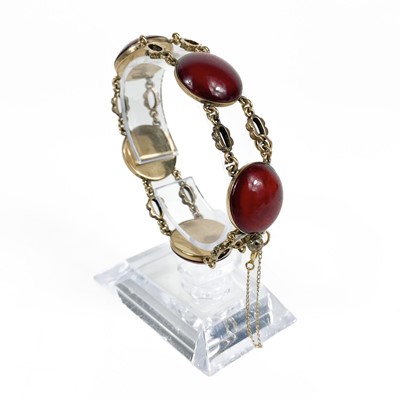 Lot 272 - A Georgian high purity gold (tests 14ct) foil back garnet bracelet.