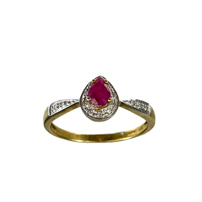 Lot 25 - A modern 9ct diamond and ruby cluster ring.