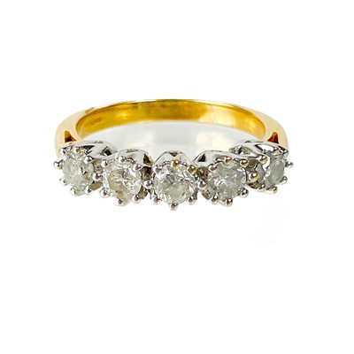 Lot 30 - A modern 18ct gold diamond set five stone ring.