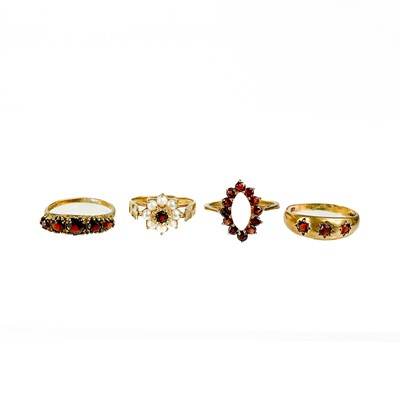 Lot 42 - Four various garnet set rings.