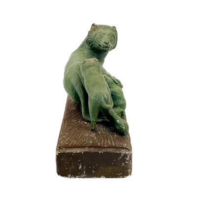 Lot 71 - A carved stone group of a lioness and three cubs.