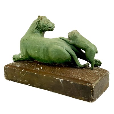 Lot 71 - A carved stone group of a lioness and three cubs.