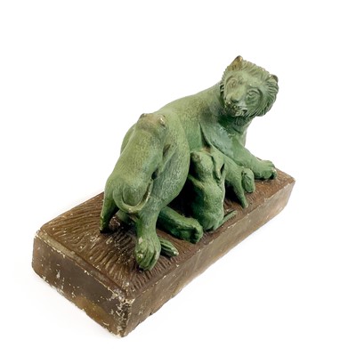 Lot 71 - A carved stone group of a lioness and three cubs.