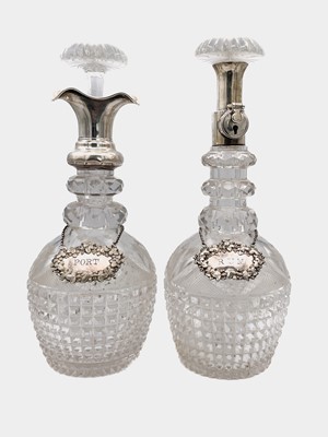 Lot 108 - A pair of silver collared cut glass decanters by Hukin & Heath Ltd