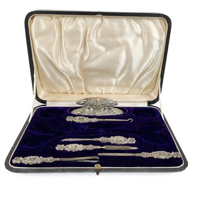 Lot 211 - An incomplete silver manicure set by Levi & Salaman