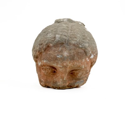 Lot 239 - A Greco-Roman carved stone fragment of a head.