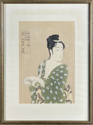 Lot 239 - A Japanese woodblock print of a semi nude lady.