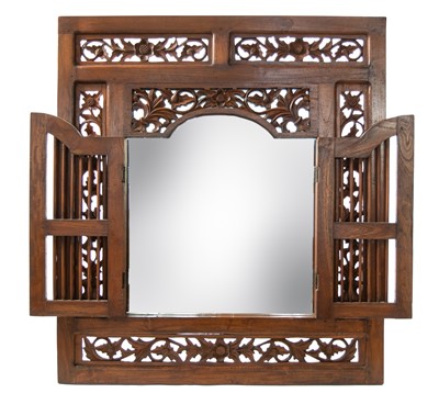 Lot 311 - A carved hardwood framed wall mirror, Kalimantan, Indonesia.