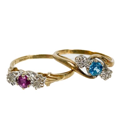 Lot 196 - Two 9ct gold diamond and gem set three stone rings.