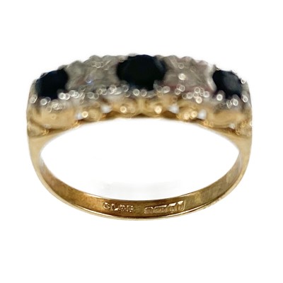 Lot 55 - Two 9ct gold diamond and sapphire set rings.