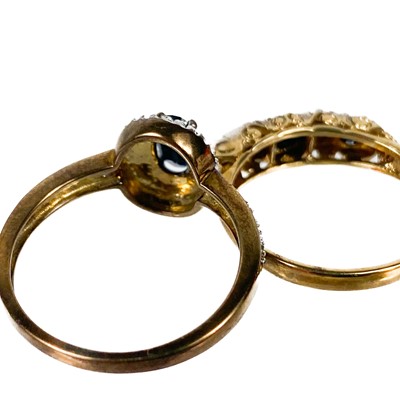 Lot 55 - Two 9ct gold diamond and sapphire set rings.
