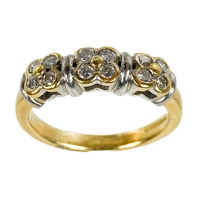 Lot 262 - A modern 18ct bi-colour gold and diamond set twelve stone ring.