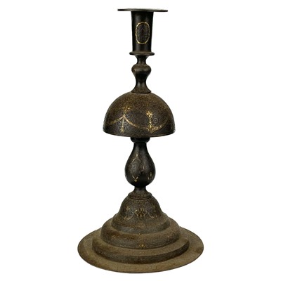 Lot 6 - A Persia iron candlestick, 18th century.