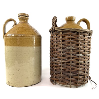 Lot 180 - Two stoneware brewery flagons, one in a basket.