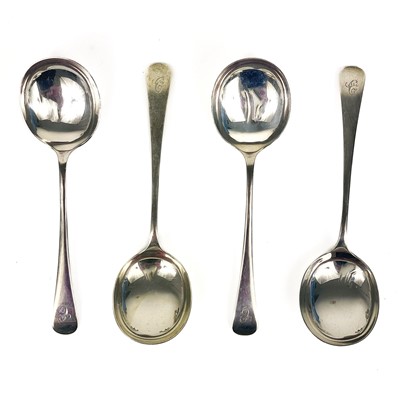 Lot 345 - A George V silver set of four Old English soup spoons by Cooper Brothers & Sons.