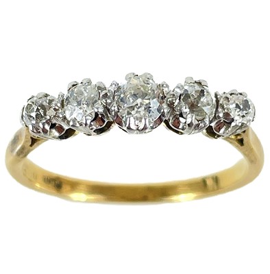 Lot 176 - An 18ct platinum diamond set five stone ring.