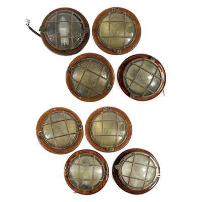 Lot 72 - A collection of eight bulkhead lights.