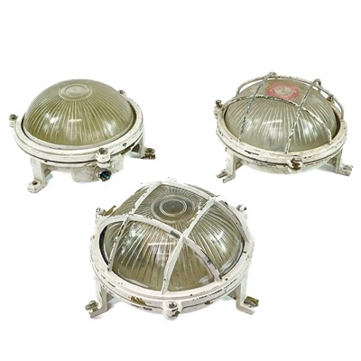 Lot 497 - A set of three marine bulkhead circular lights.