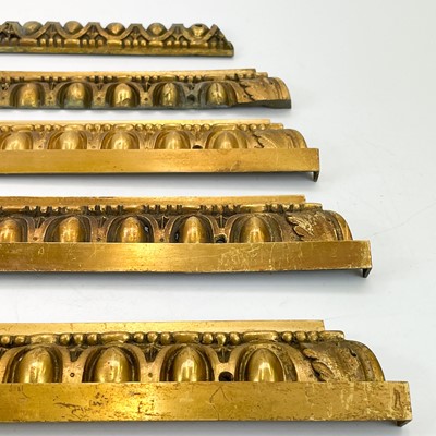 Lot 148 - Eleven decorative brass moulding sections/