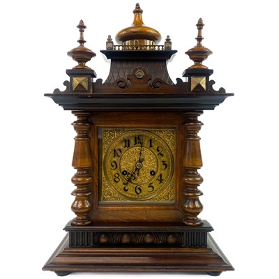 Lot 1705 - A German Black Forest style walnut mantel clock.