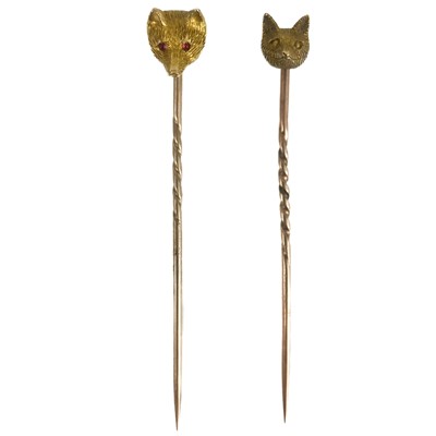 Lot 266 - Two 15ct gold fox head stick pins.