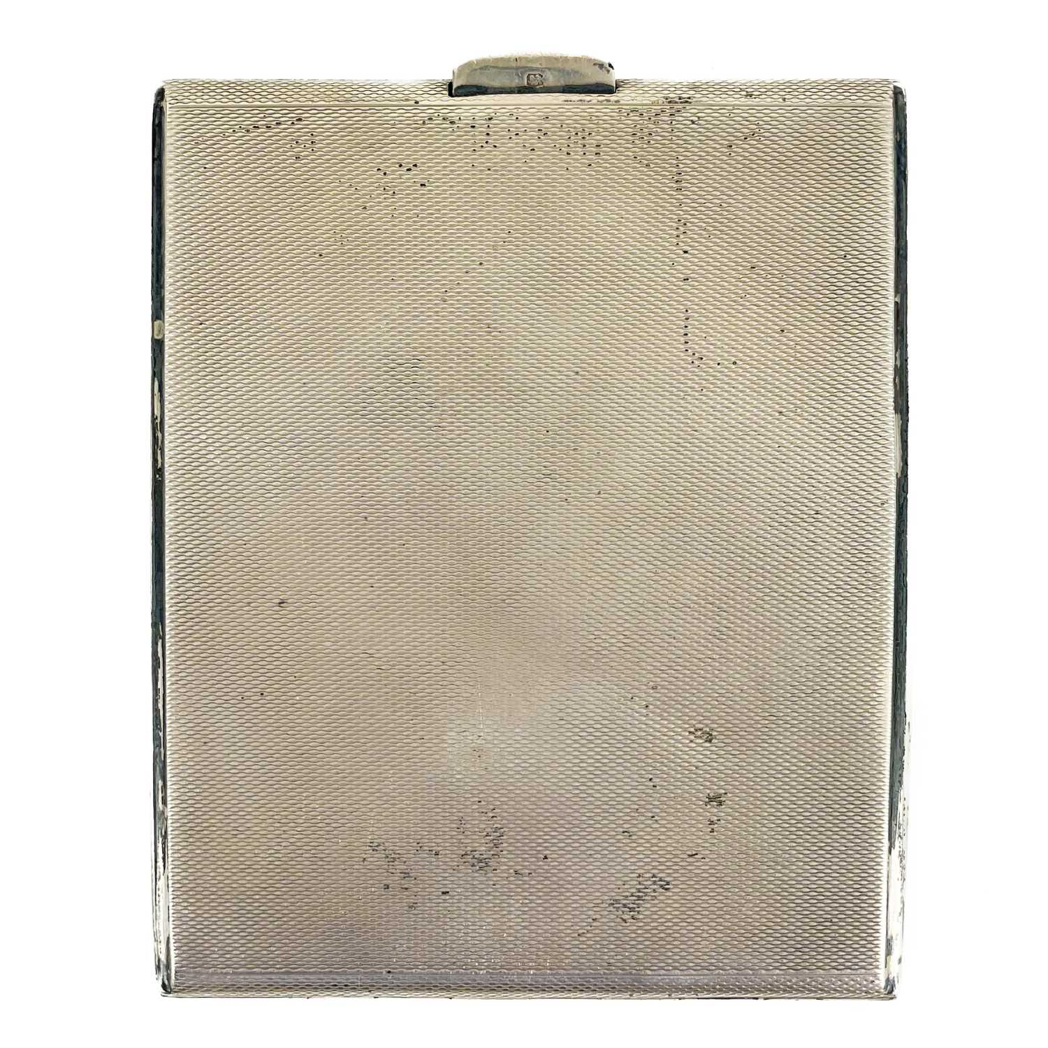 Lot 15 - A silver engine turned cigarette case by