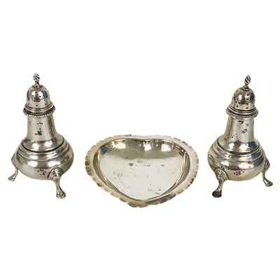 Lot 280 - A pair of George V silver baluster pepper casters.