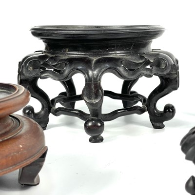 Lot 40 - A pair of Chinese hardwood vase stands, 19th century.