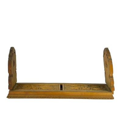 Lot 34 - An Anglo-Indian carved wood extending folding bookslide, early 20th century.