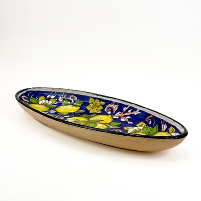 Lot 819 - A large studio pottery fruit bowl together with an oval serving dish.