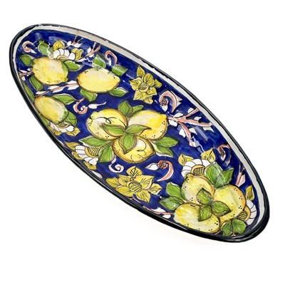 Lot 819 - A large studio pottery fruit bowl together with an oval serving dish.