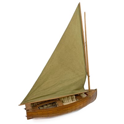 Lot 498 - A fine scratch built model of a small sail boat.