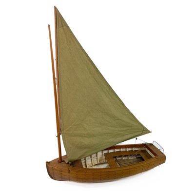 Lot 498 - A fine scratch built model of a small sail boat.