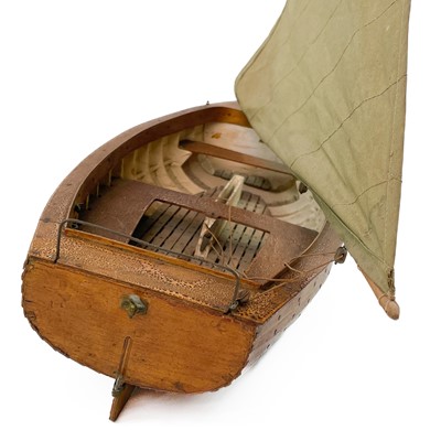 Lot 498 - A fine scratch built model of a small sail boat.