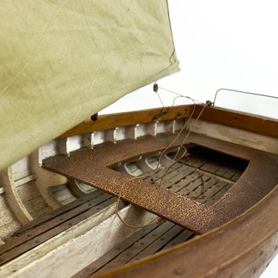 Lot 498 - A fine scratch built model of a small sail boat.