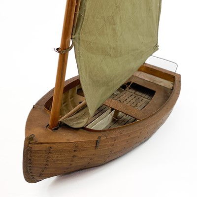 Lot 498 - A fine scratch built model of a small sail boat.
