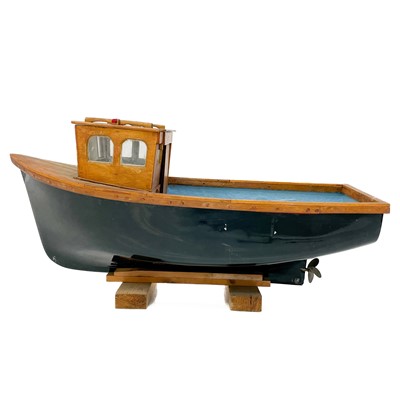 Lot 494 - A large model of a boat with fibreglass hull.