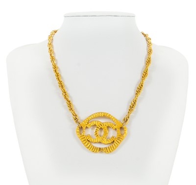 Lot 381 - A Chanel gold tone CC pendant choker necklace.