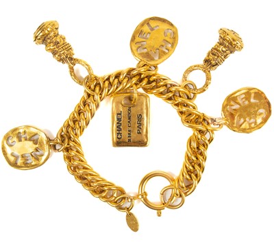 Lot 375 - A Chanel gold tone charm bracelet.