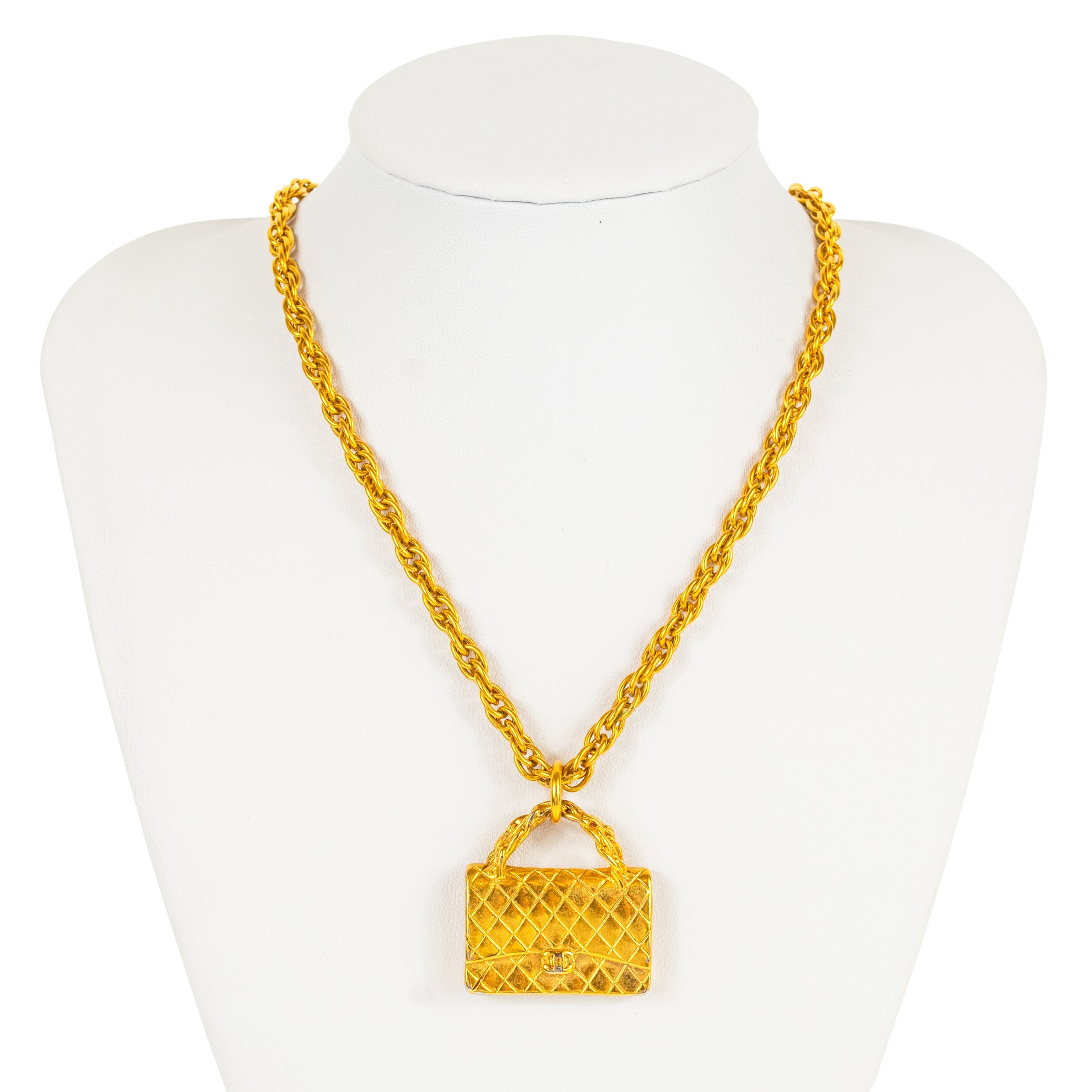 Lot 361 - A Chanel gold tone quilted handbag pendant