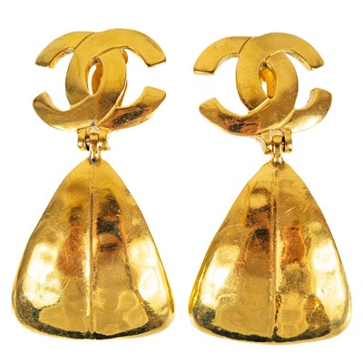 Lot 369 - A pair of Chanel gold tone pendant clip earrings.