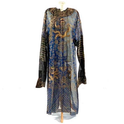 Lot 46 - A Chinese silk embroidered dragon robe, late 19th/early 20th century.