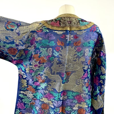 Lot 47 - A Chinese silk embroidered dragon robe, early 20th century.